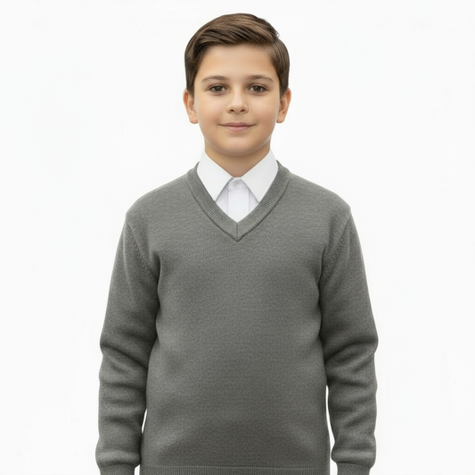 Young boy wearing a red sweater over a white shirt on a white background