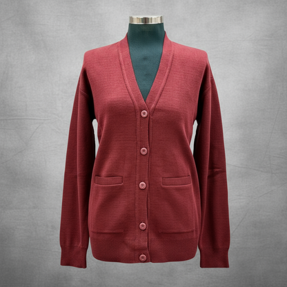 A green school cardigan with a V-neckline, button-up front, and ribbed cuffs on a mannequin.