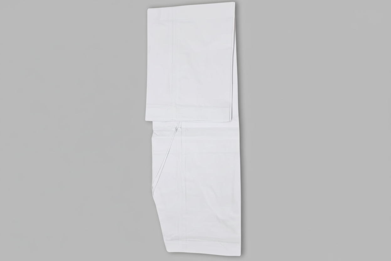 A traditional Pakistani Kamiz Shalwar garment in a solid color, laid flat on a white background.