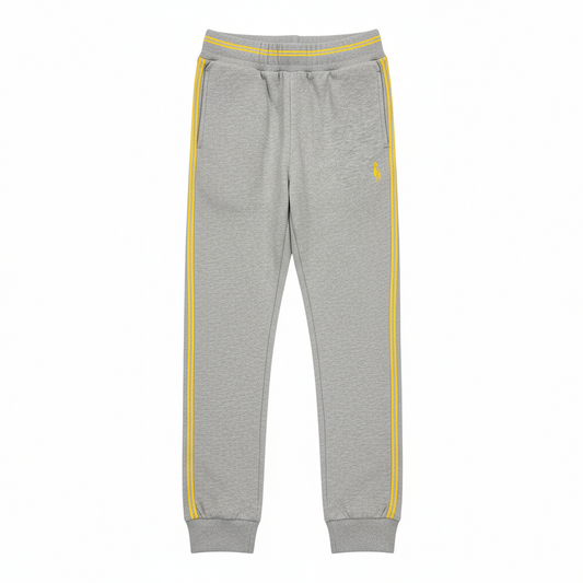 A pair of gray sports trousers with yellow stripes and a visible logo on the lower right side, designed for children.