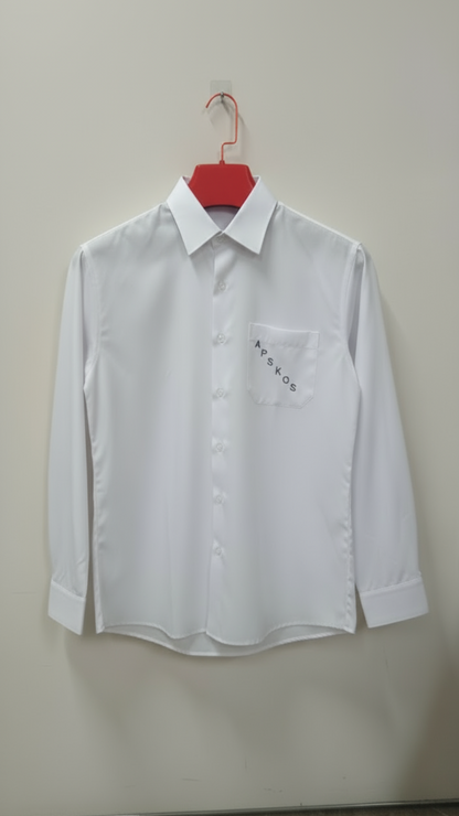 White dress shirt on a hanger against a white wall with shelves in the background.