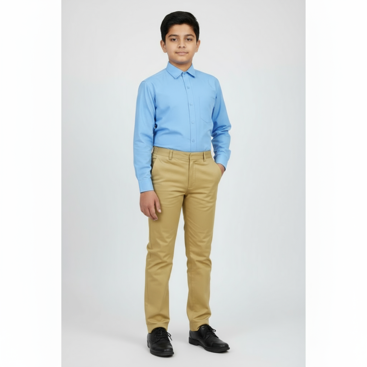 Person on a white background wearing a light blue shirt and beige pant