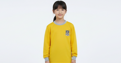 A yellow unisex long-sleeved sports shirt with a grey collar and a logo on the chest.